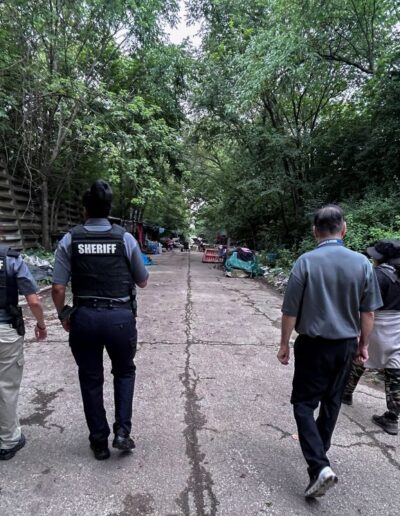 FROM L TO R OFFICER NADIA SHEHADEH OFFICER SHAVONIA BROWN SERGIO CISNEROS WALKS THROUGH HOMELESS ENCAMPMENT ON 31ST CICERO