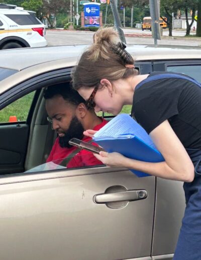 Rachel Niesen informs Richton Park resident about other community programs offered by the Cook County Sheriffs Office