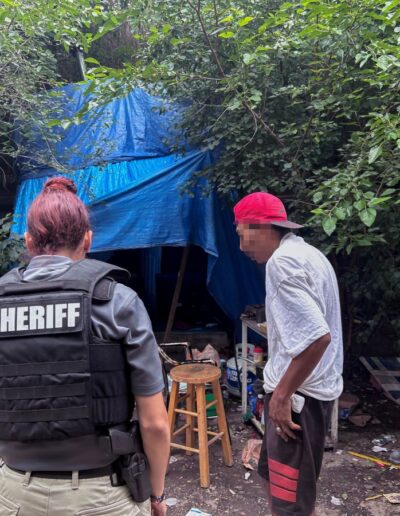 OFFICER NADIA SHEHADEH MAKES SURE INDIVIDUAL IN HOMELESS ENCAMPMENT HAS EVERYTHING HE NEEDS TO GET THROUGH THE DAY